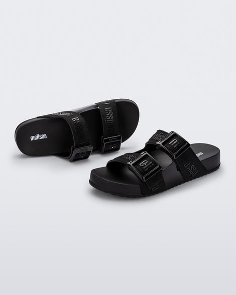 Top and angled view of a pair of black Cozy M Love adult slides