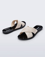 Back and angled view of a pair of black Essential Cross Slide sandals with beige colored straps