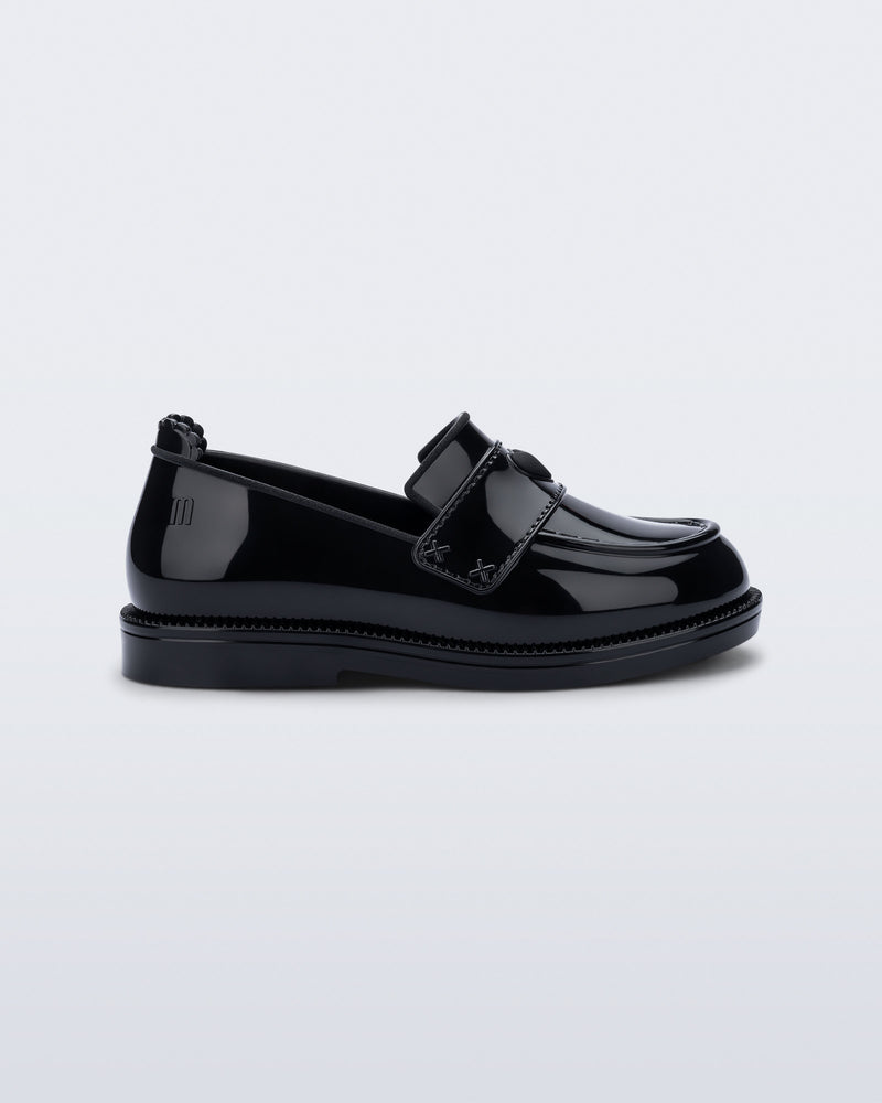 Side view of a black Royal Love baby loafer