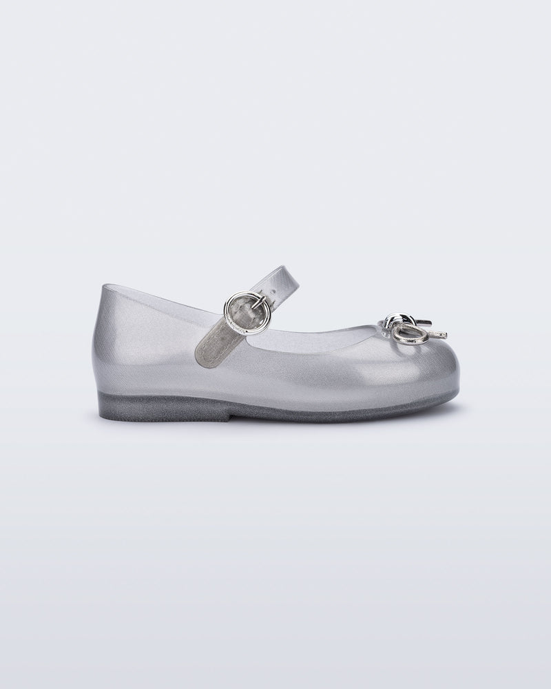Side view of a silver Sweet Love Chrome baby flat with metallic silver bow and buckle