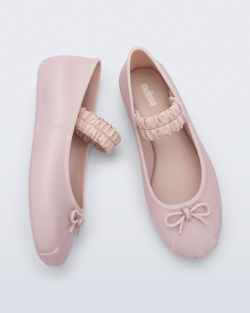 Side and top view of a pair of pink Sophie Scrunch flats