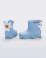 Side and back view of a pair of blue Welly Bloomy boots with white daisy on back