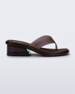Side view of a brown Margot flip flop with low heel