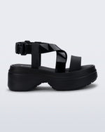 Side view of a black Stand platform sandal