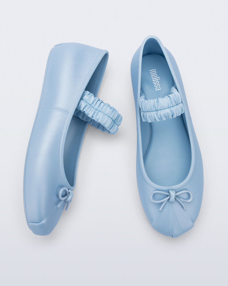 Side and top view of a pair of blue Sophie Scrunch flats