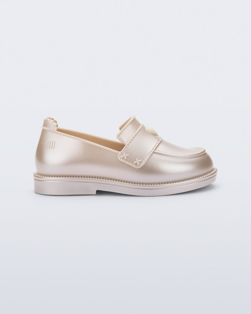 Side view of a metallic beige Royal Love baby loafer