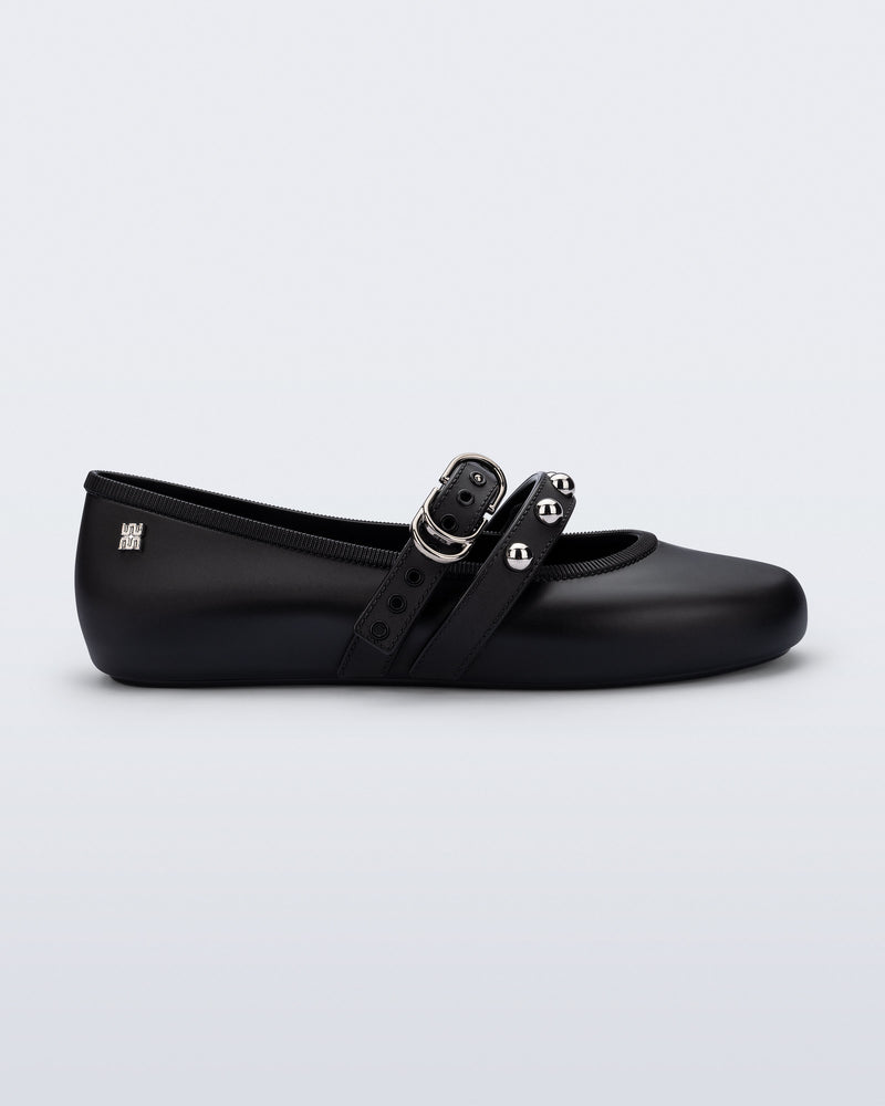 Side view of a black Soft Ballerina Studs flat with silver embellishments