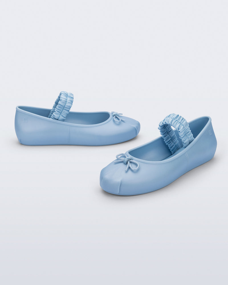 Side and angled view of a pair of blue Sophie Scrunch flats