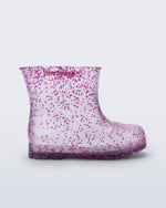 Side view of a clear with pink glitter Welly baby rain boot