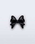 Front view of a black bow shoe charm