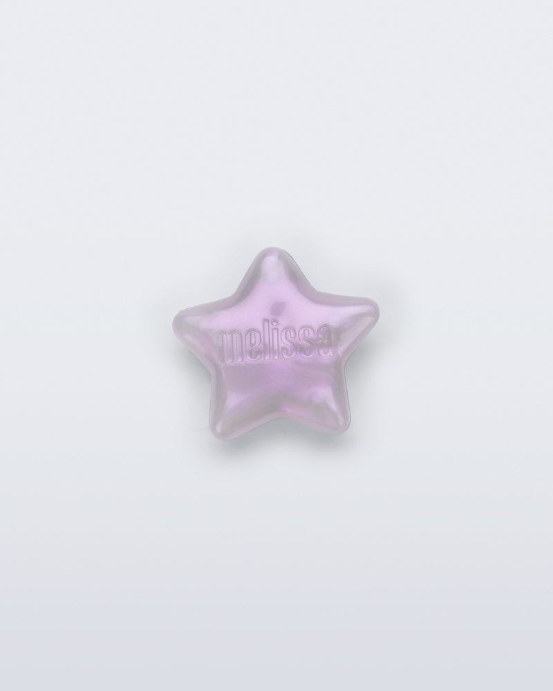 Front view of a pearly lilac star shoe charm