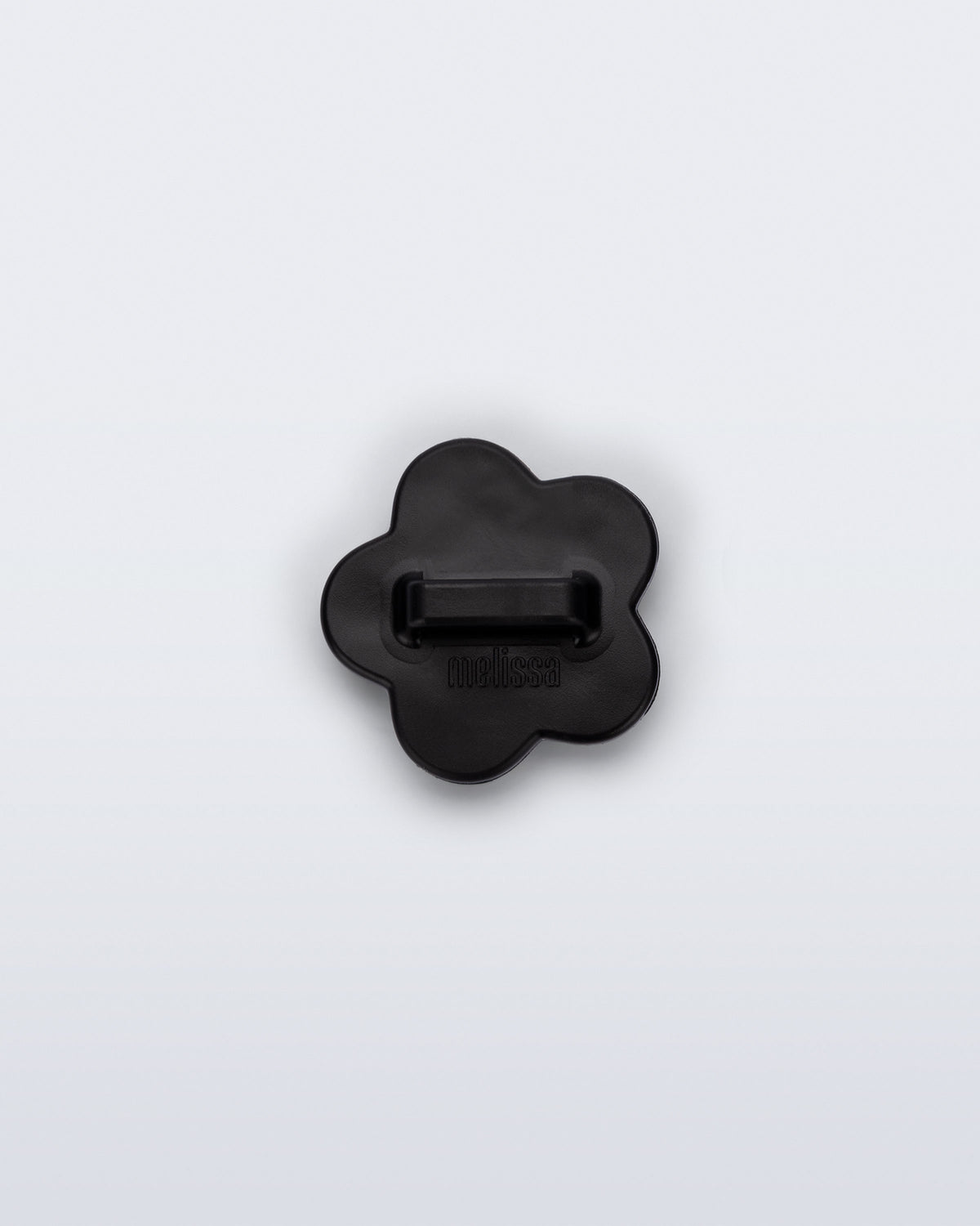 Back view of a black flower shoe charm