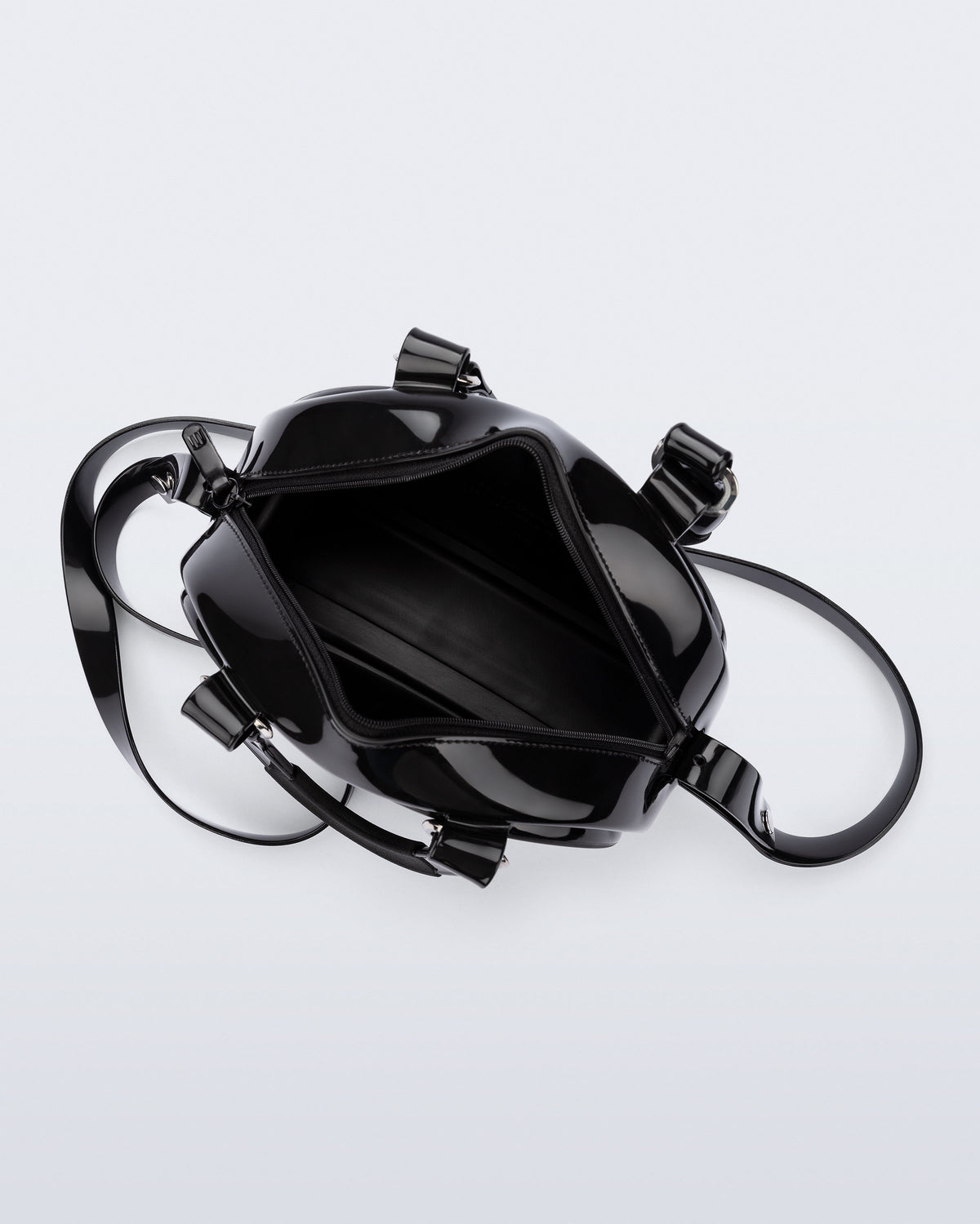 Top view of a black Bowling bag with handle strap and cross body strap