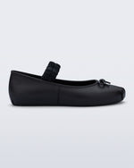 Side view of a black Sophie Scrunch flat