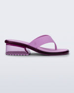 Side view of a pink Margot flip flop with clear pink low heel