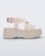Side view of a beige Stand platform sandal
