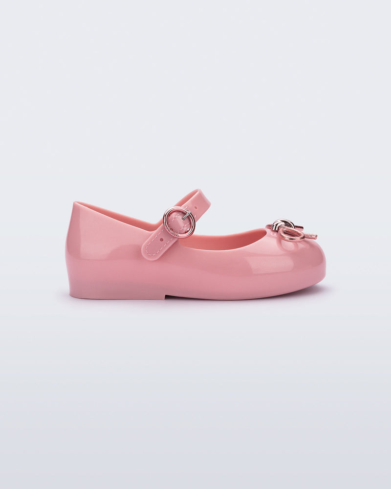 Side view of a pink Sweet Love Chrome baby flat with metallic pink bow and buckle