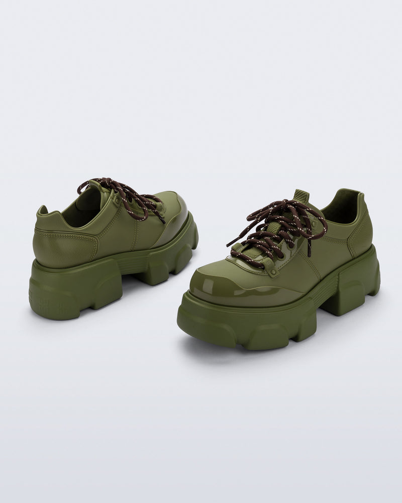 Back and angled view of a pair of army green Camp platform Sneakers with brown laces