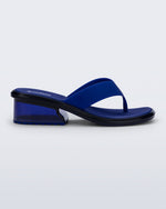 Side view of a blue Margot flip flop with clear blue low heel