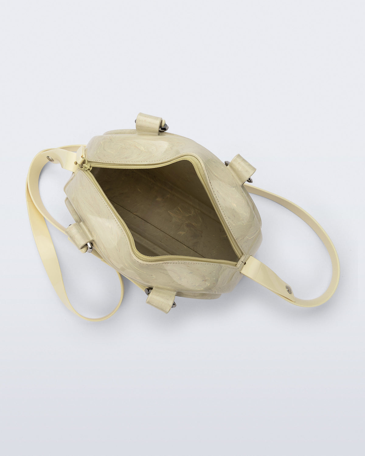 Top view of a beige Bowling bag with handle strap and cross body strap