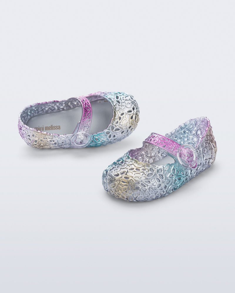 Top and angled view of a pair of pearly blue Pollen baby flats