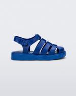 Side view of a blue Megan baby sandal.