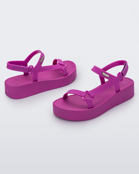 Angled view of a pair of dark pink Sun Downtown Platform sandals