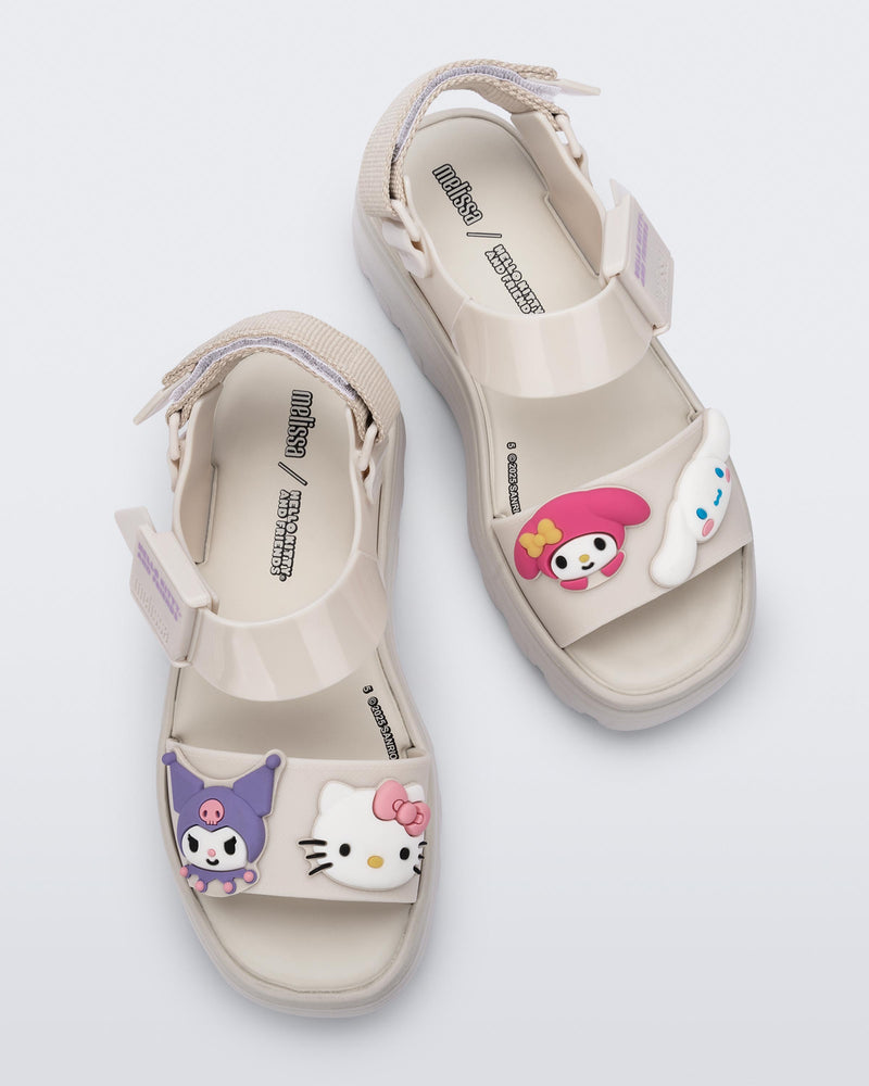 Top view of a pair of beige Kick Off Sandals + Hello Kitty and Friends with Hello Kitty and Friends on the upper strap