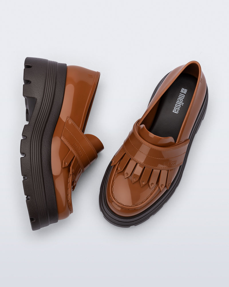 Top and side view of a pair of brown Royal Plus Platform loafers with black sole