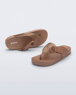 Top and angled view of a pair of brown Cozy Thong Flip flops