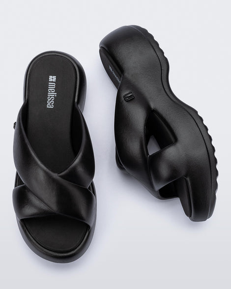 Side and top view of a pair of black Free Rise platform slide