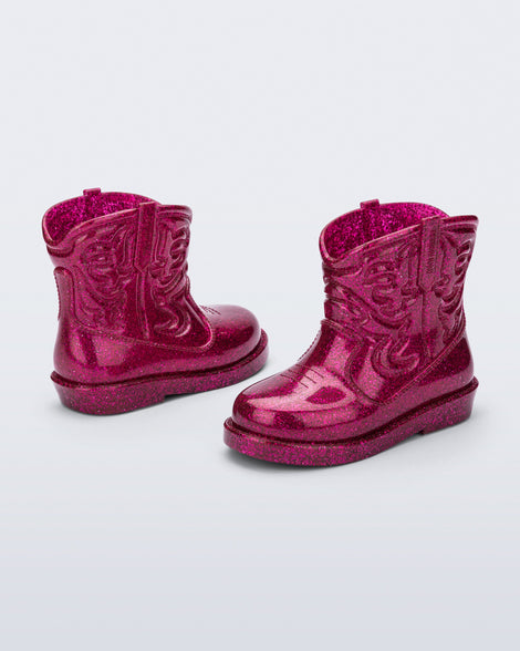 Back and side view of a pair of glitter pink Texas baby boots