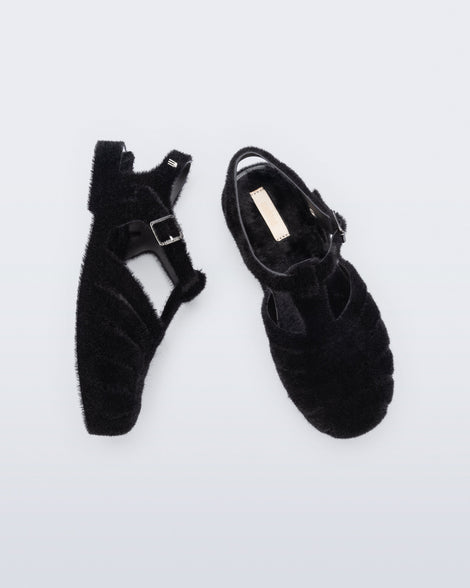 Top and side view of a pair of black fuzzy Possession Warm fisherman sandals