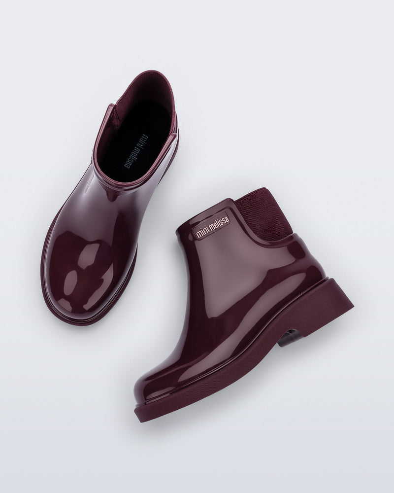 Top and side view of a pair of burgundy Chelsea II kids boots