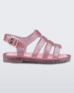 Side view of a pink/glitter silver Flox baby sandal
