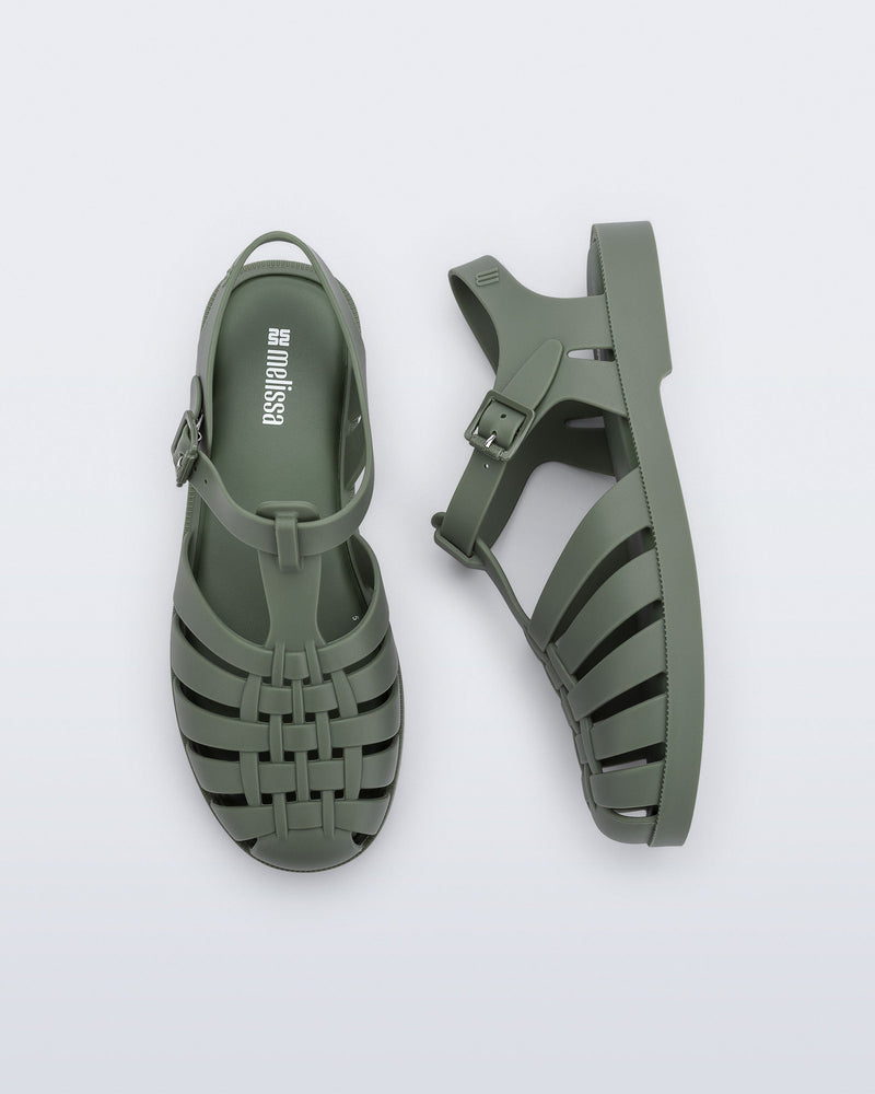 Top and side view of a pair of dark green Possession fisherman sandals