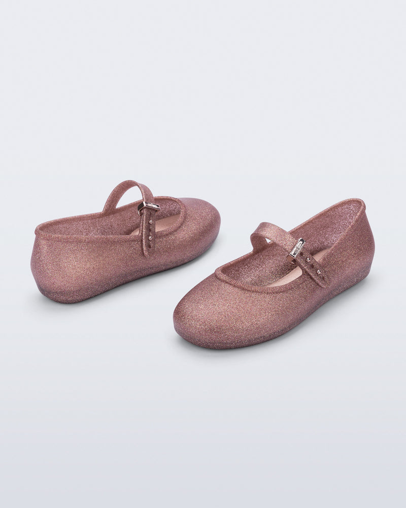 Side and top angled view of a pair of glitter pink Soft Ballerina kids flats