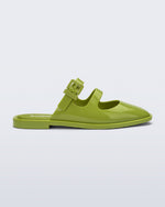 Side view of a green Anastasia mule slide with upper straps