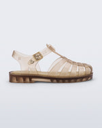 Side view of a transparent beige Possession kids sandal