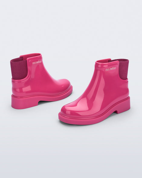 Back and side view of a pair of pink Chelsea II kids boots