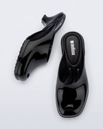 Top and side view of a pair of black Gaia kitten heels with peep toe