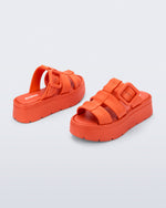 Back and angled view of a pair of orange Pump Platform sandals