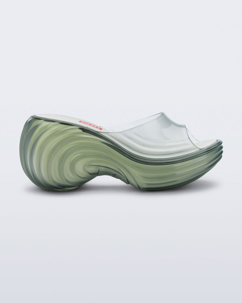 Side view of a transparent green Platforms + Diesel slides