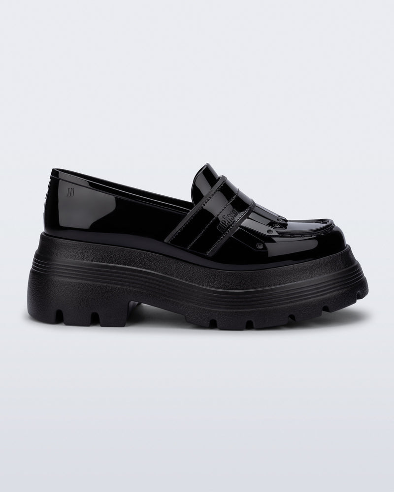 Side view of a black Royal Plus platform loafer