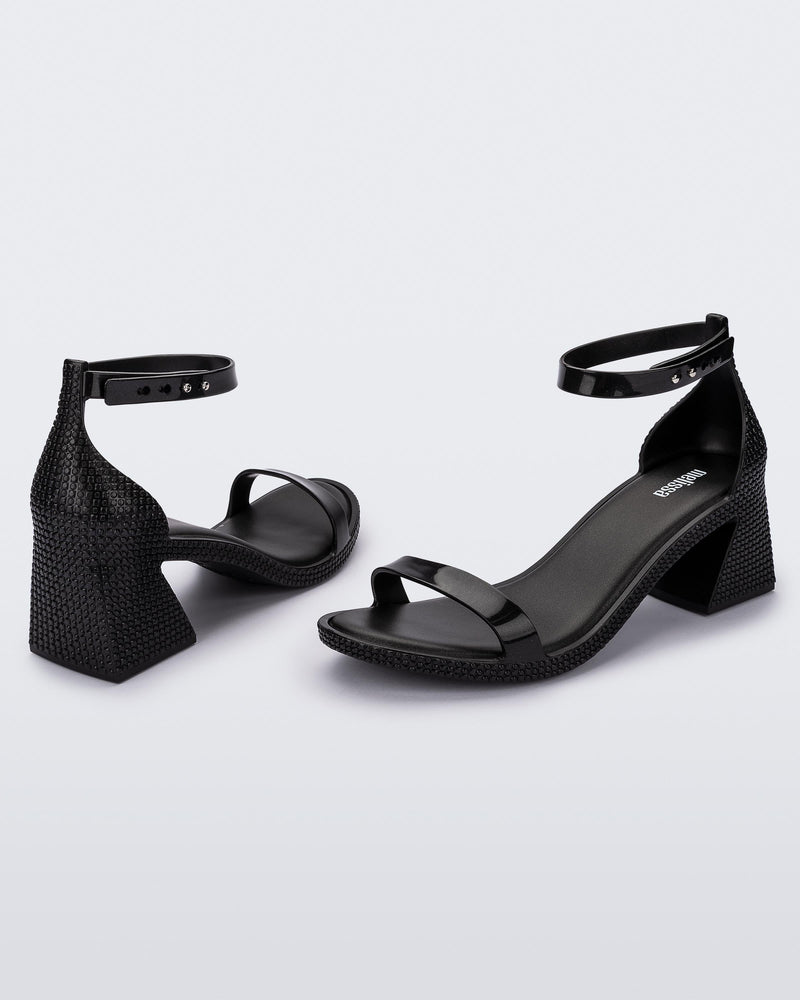 Angled view of a pair of metallic black Lux Heels