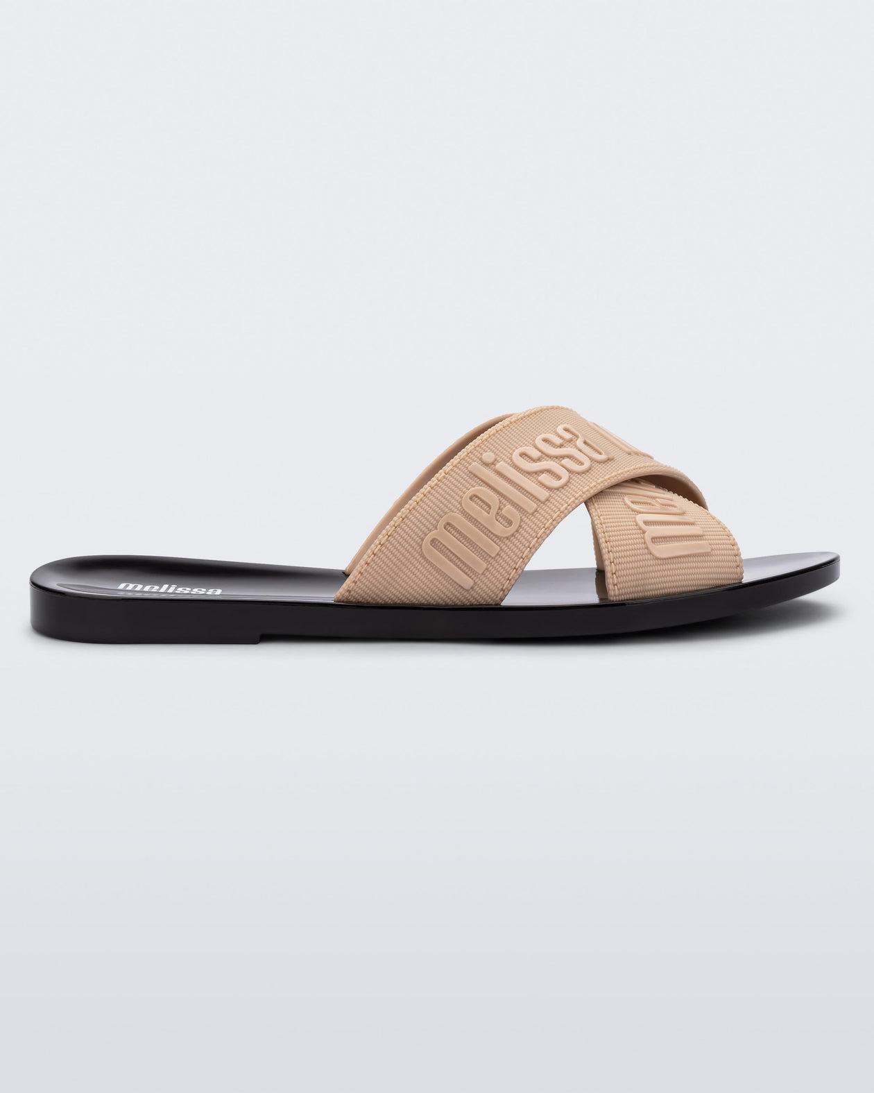 Side view of a beige M Lover adult slide with black sole