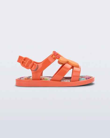 Side view of a orange Colorland Moana baby sandal