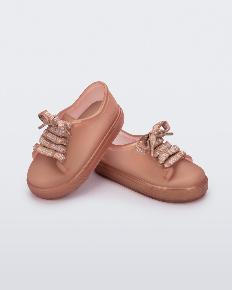 Angled view of a pair of pearly brown baby Hip M Lover sneakers with laces