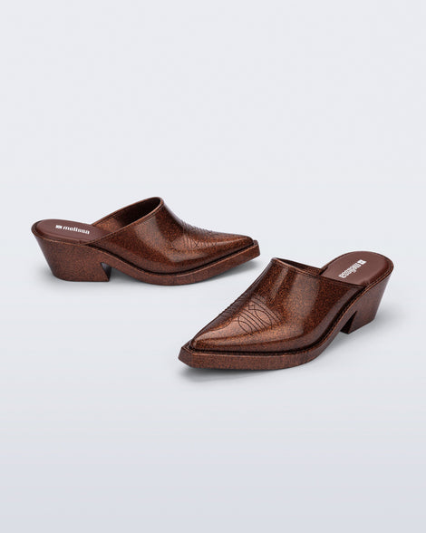 Side and angled view of a pair of bronze glitter Texas Mule heels