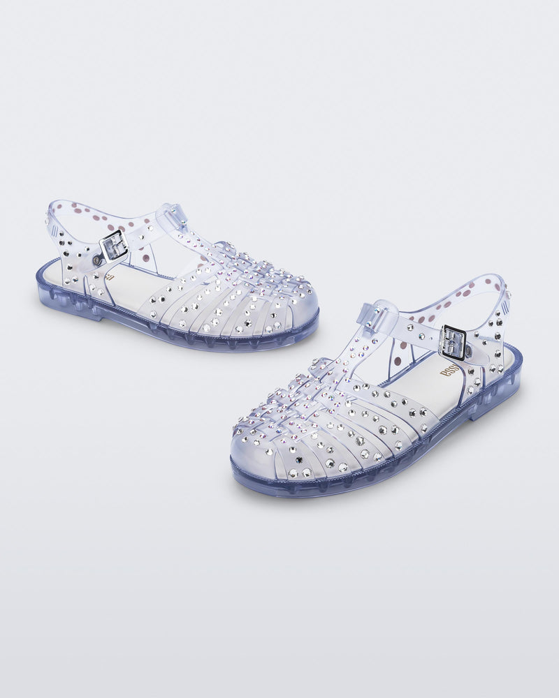 Angled view of a pair of clear Possession Crystals sandals